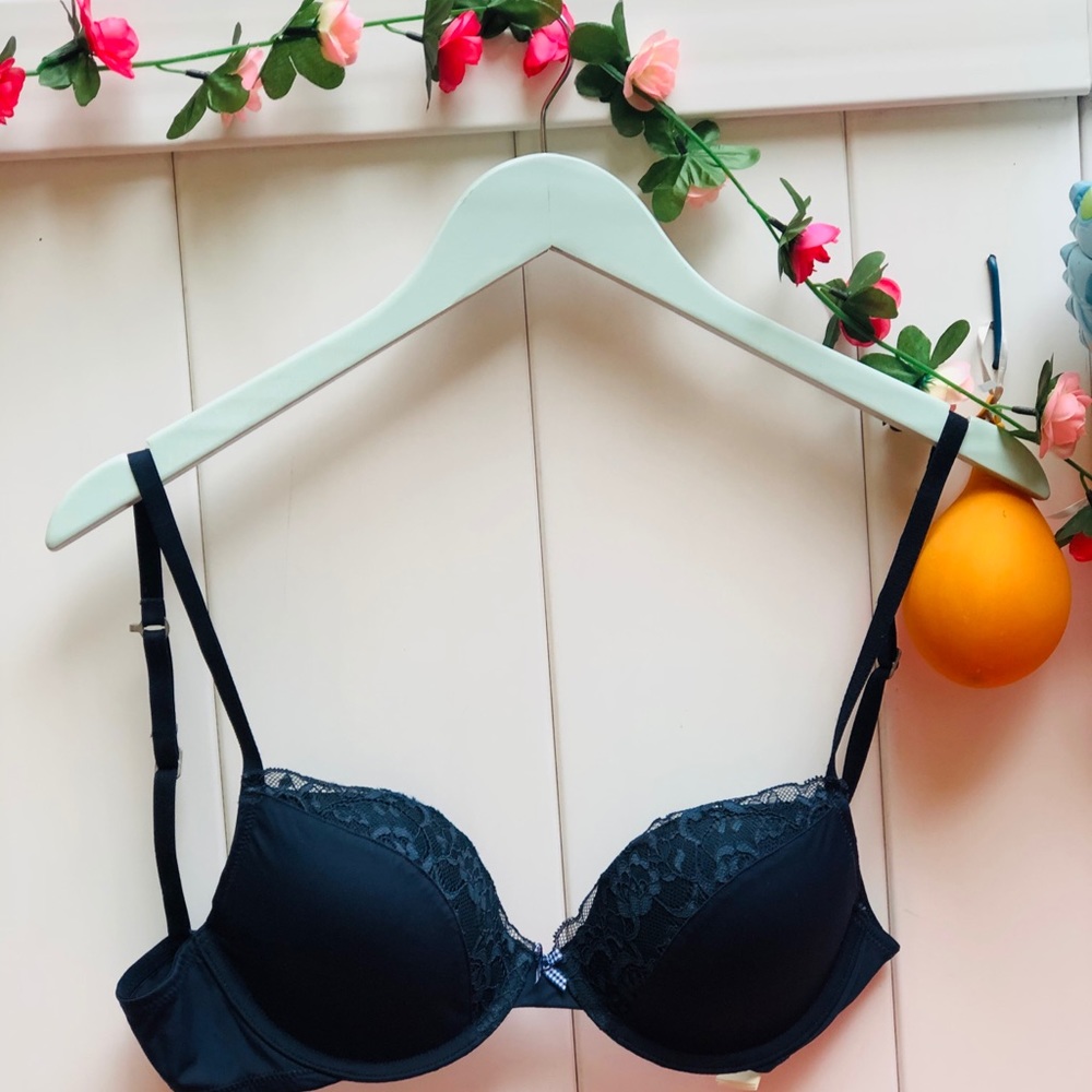 Never worn navy blue lightly lined plunge bra